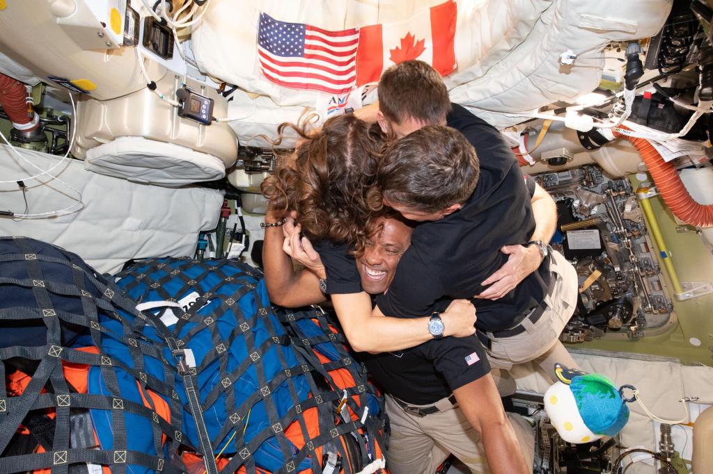 Moon Joy (April 7, 2026) – The Artemis II crew – (clockwise from left) Mission Specialist Christina Koch, Mission Specialist Jeremy Hansen, Commander Reid Wiseman, and Pilot Victor Glover – take time out for a group hug inside the Orion spacecraft on their way home. Following a swing around the far side of the Moon on April 6, 2026, the crew exited the lunar sphere of influence (the point at which the Moon's gravity has a stronger pull on Orion than the Earth's) on April 7, and are headed back to Earth for a splashdown in the Pacific Ocean on April 10. The crew was selected in April 2023, and have been training together for their mission for the past three years.
Image Credit: NASA